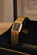 Vintage Ladies Gold Bulova Quartz Black Dial Tank Watch in Box Working