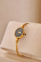 1970s Ladies Gold Plated Raymond Weil Bangle Watch Oval Black Dial Manual Wind