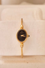 1970s Ladies Gold Plated Raymond Weil Bangle Watch Oval Black Dial Manual Wind