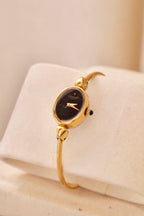 1970s Ladies Gold Plated Raymond Weil Bangle Watch Oval Black Dial Manual Wind