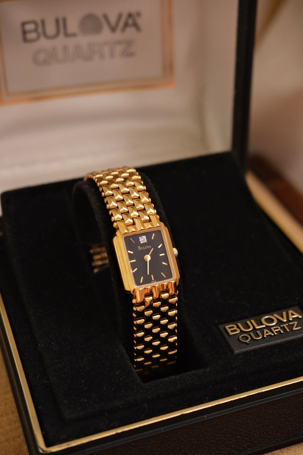 Vintage Ladies Gold Bulova Quartz Black Dial Tank Watch in Box Working
