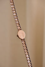 1980s Vintage 9ct Yellow Gold Sovereign quartz dress watch with an oval case and a textured link bracelet