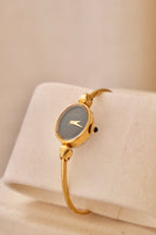 1970s Ladies Gold Plated Raymond Weil Bangle Watch Oval Black Dial Manual Wind