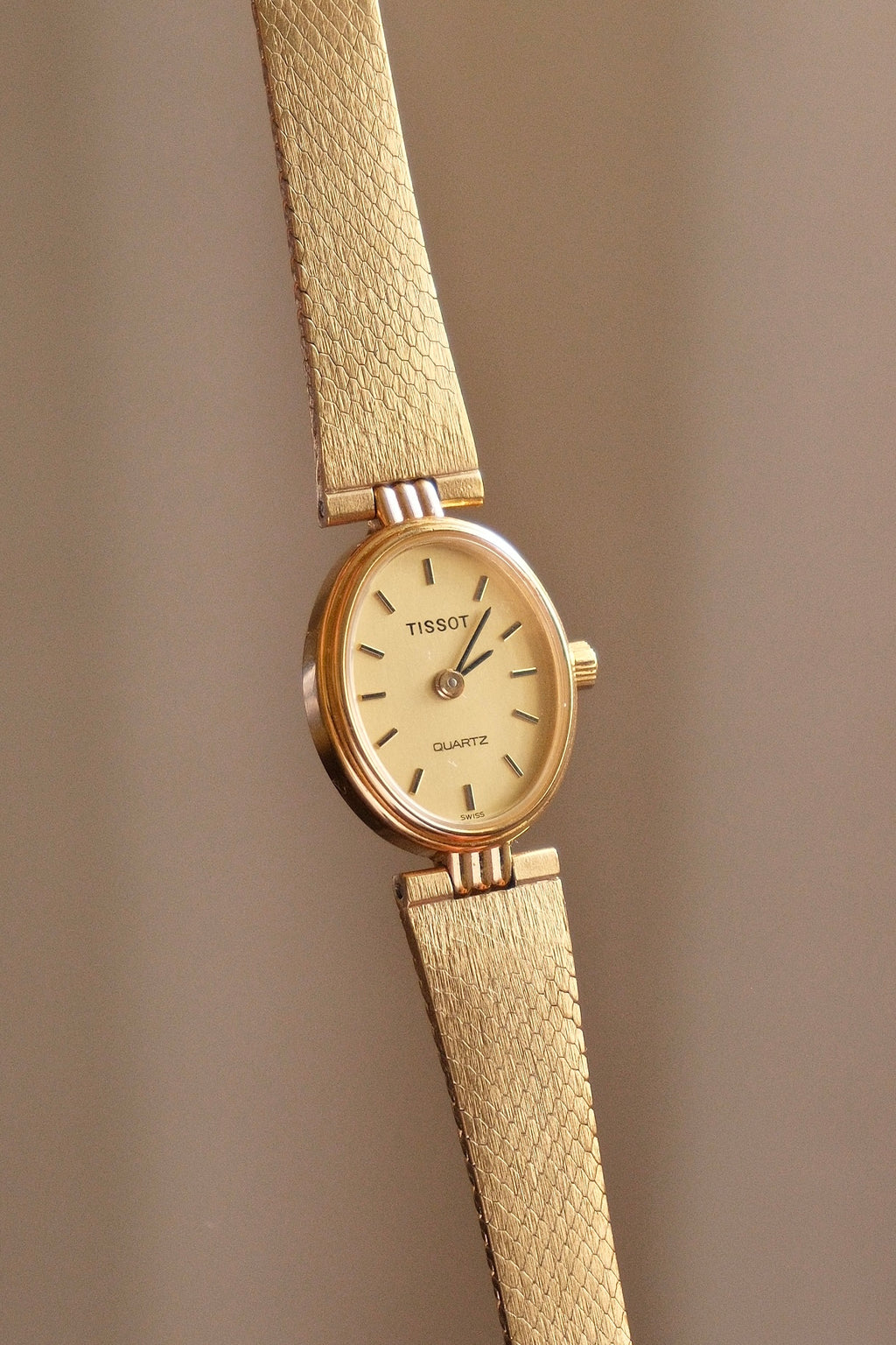 Vintage 1980s Tissot Ladies Gold Oval Watch - Swiss Quartz Cocktail Dress Wristwatch with Integrated Mesh Pattern Mesh Bracelet