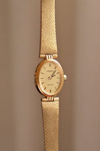 Vintage 1980s Tissot Ladies Gold Oval Watch - Swiss Quartz Cocktail Dress Wristwatch with Integrated Mesh Pattern Mesh Bracelet