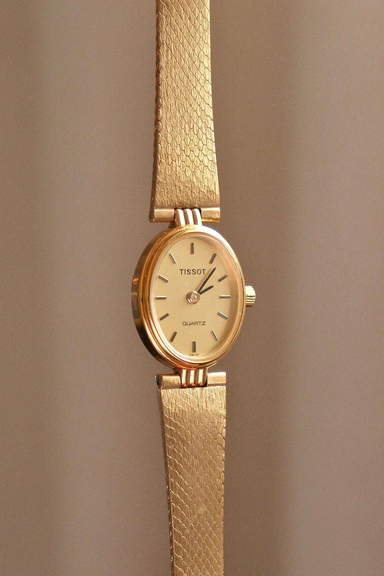 Vintage 1980s Tissot Ladies Gold Oval Watch - Swiss Quartz Cocktail Dress Wristwatch with Integrated Mesh Pattern Mesh Bracelet