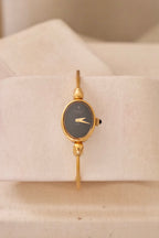 1970s Ladies Gold Plated Raymond Weil Bangle Watch Oval Black Dial Manual Wind