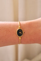 1970s Ladies Gold Plated Raymond Weil Bangle Watch Oval Black Dial Manual Wind
