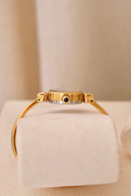 1970s Ladies Gold Plated Raymond Weil Bangle Watch Oval Black Dial Manual Wind