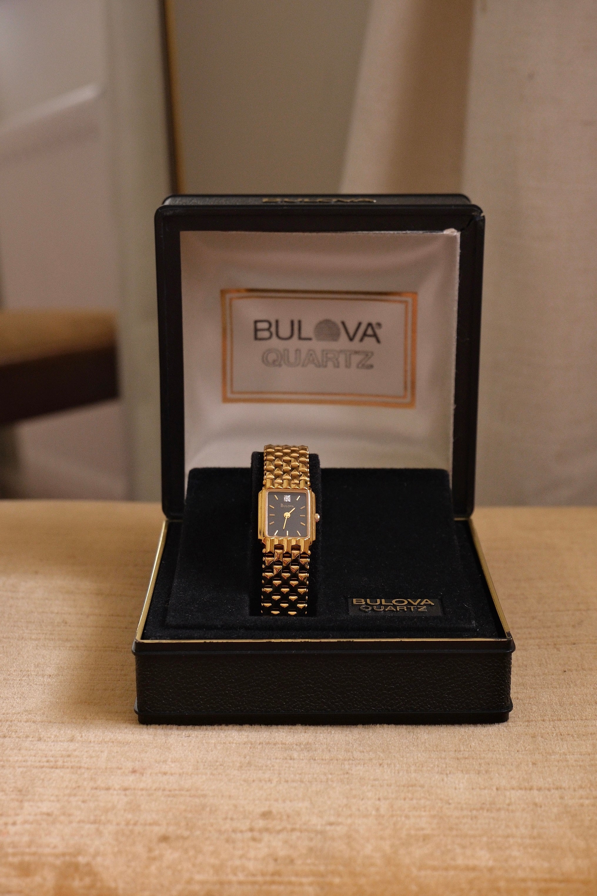 Vintage Ladies Gold Bulova Quartz Black Dial Tank Watch in Box Working