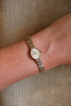 1980s Vintage 9ct Yellow Gold Sovereign quartz dress watch with an oval case and a textured link bracelet
