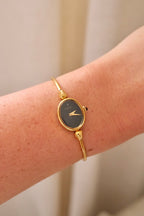1970s Ladies Gold Plated Raymond Weil Bangle Watch Oval Black Dial Manual Wind