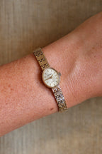 1980s Vintage 9ct Yellow Gold Sovereign quartz dress watch with an oval case and a textured link bracelet